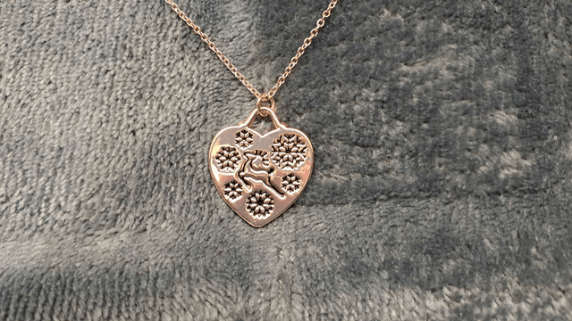 Rose Gold Coloured Reindeer and Snowflakes Heart Shaped Pendant Necklace.