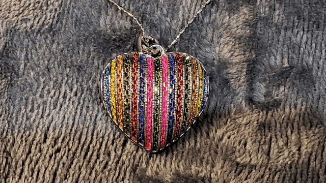 Silver Coloured Filigree Heart Pendant Necklace With Rainbow Back
